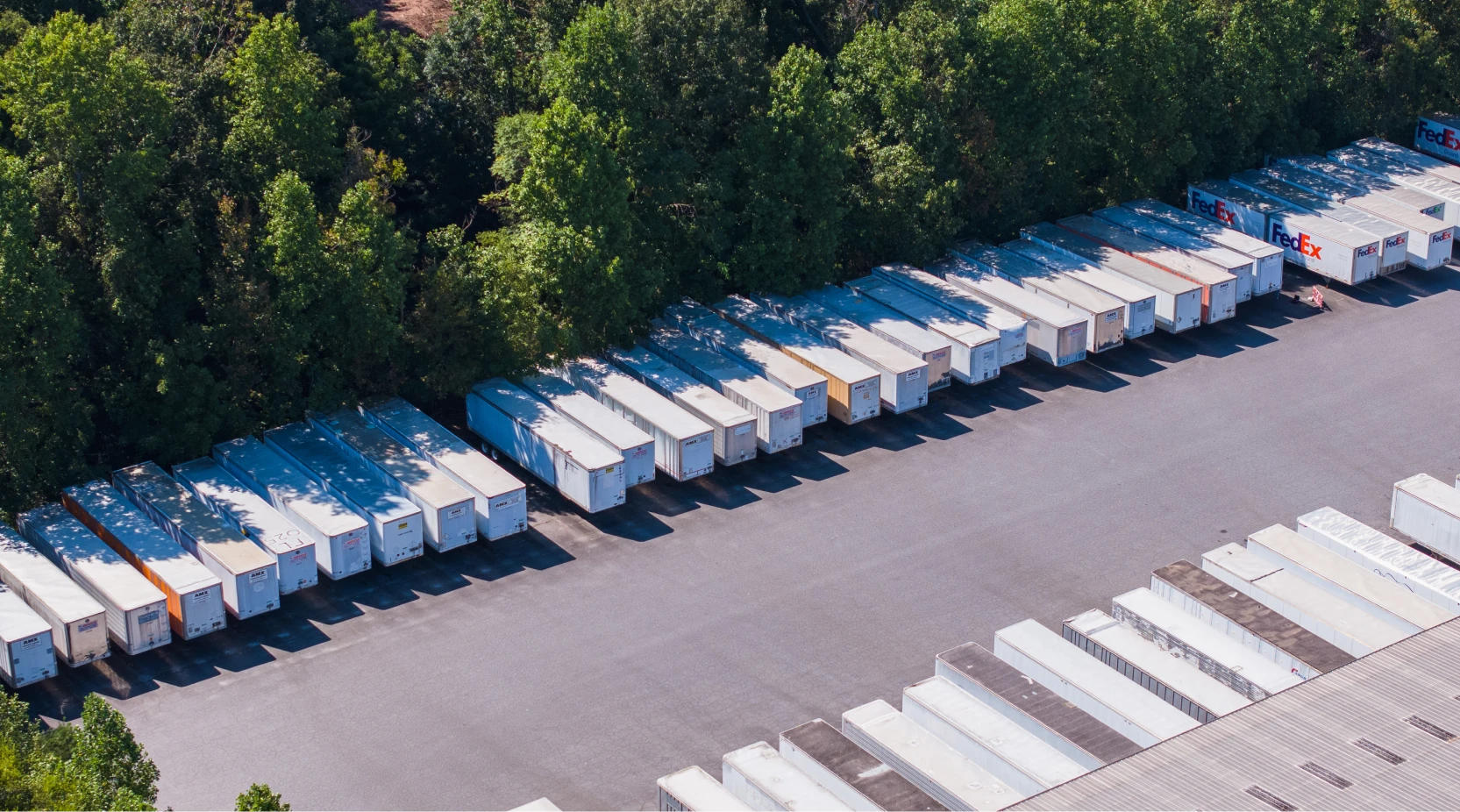 Overhead view of numerous white 3PL warehouse storage units neatly arranged in Greater Charlotte.