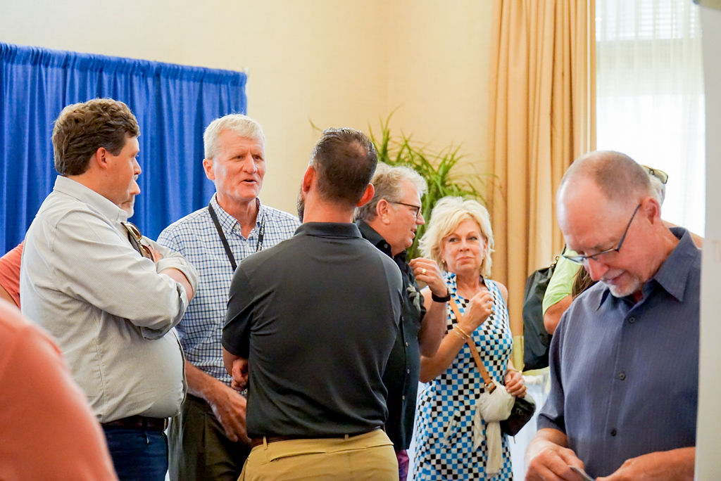 Group of attendees networking at a warehousing and distribution event near Asheville, NC, during a logistics conference.