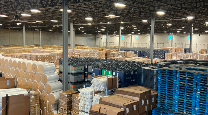 A large 3PL warehouse in Charlotte storing pallets, packaging materials, and inventory, supporting Just in Time logistics for businesses.